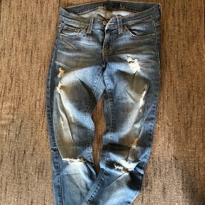 Distressed light denim skinny jeans